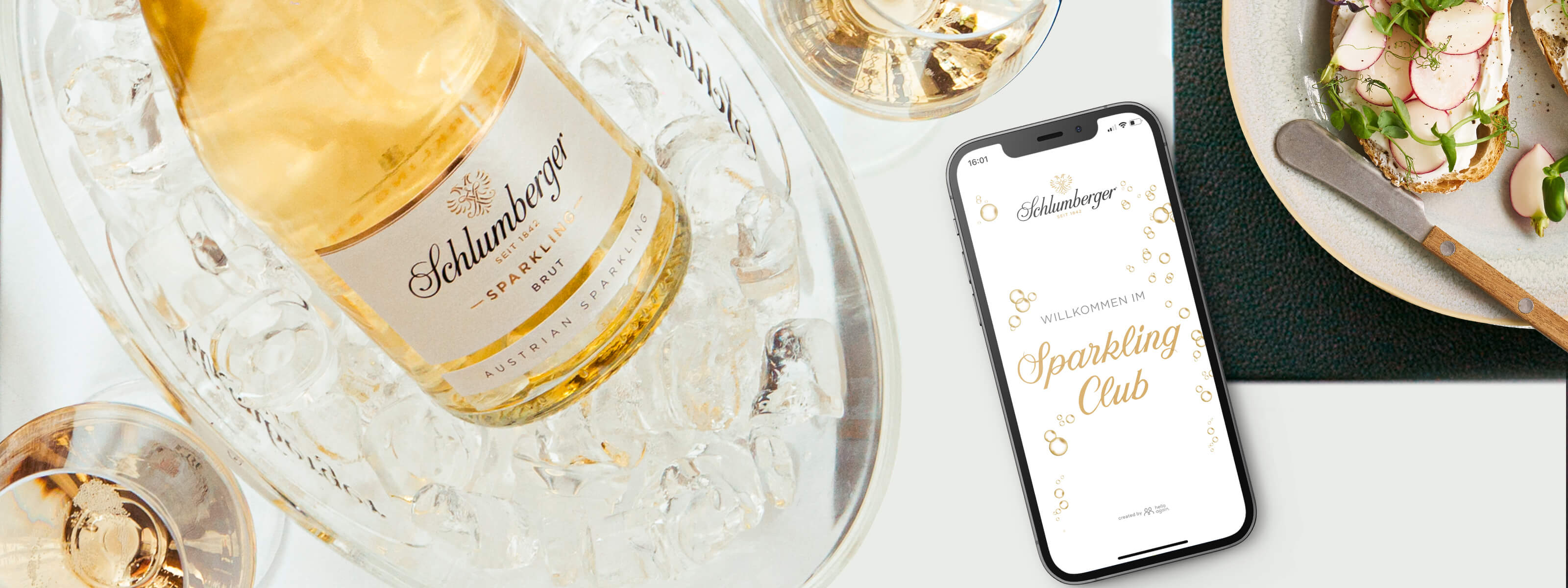 Schlumberger Sparkling Club App geöffnet am Tische